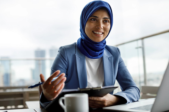 woman talking at table in office