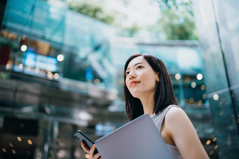 woman outside with laptop