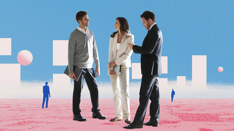 Three professionals, two men and a woman, stand together on a pink, abstract landscape under a bright blue sky with geometric white shapes and spheres. They appear engaged in a friendly conversation, dressed in business casual and formal attire. Distant figures are scattered in the background, adding depth to the scene. The image conveys collaboration and innovation.