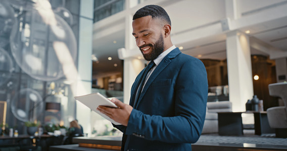 man reading in lobby