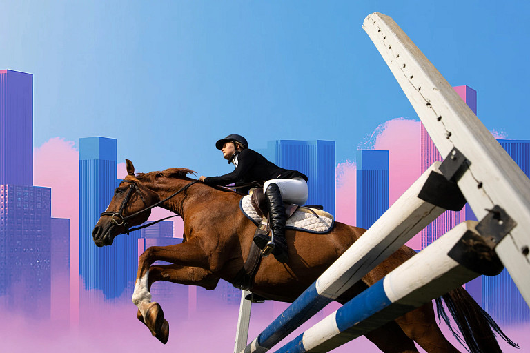 A horse and rider in equestrian gear leap over a striped jump against a backdrop of tall, colorful city buildings and a bright blue sky with pink accents, symbolizing ambition and overcoming challenges.